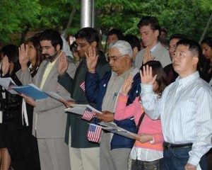 new_citizens_oath New US citizens taking the Pledge of Alligiance. Photo: USCIS